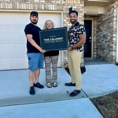 Teré Calloway with clients on closing day