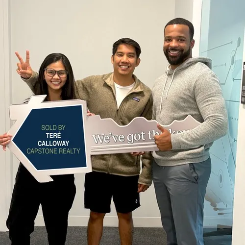 Teré Calloway with clients on closing day