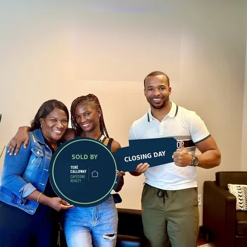 Teré Calloway with clients on closing day