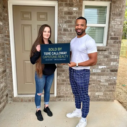 Teré Calloway with clients on closing day