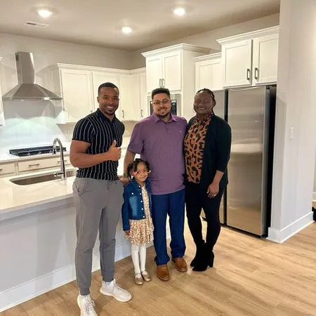Teré Calloway with clients on closing day
