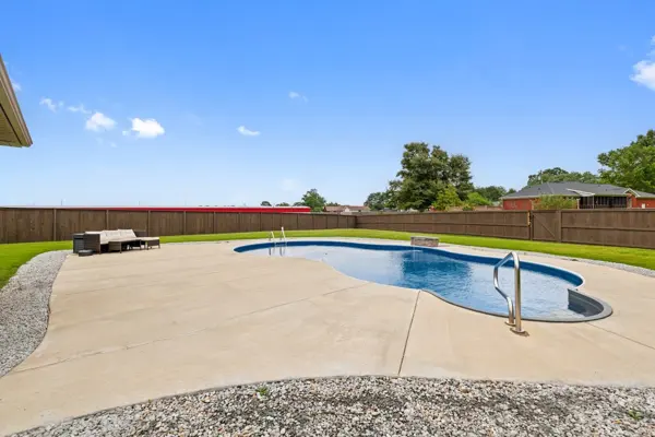 Sun deck wraps the pool, with room left over