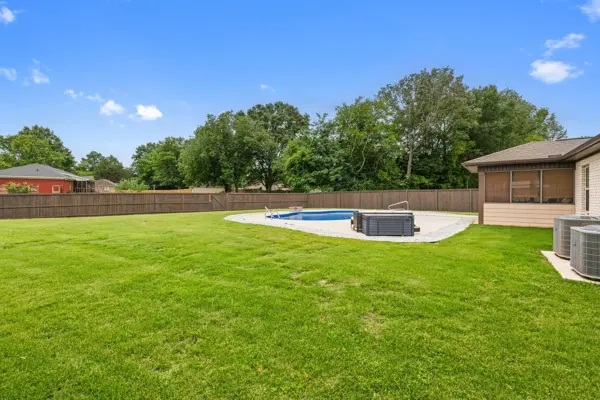 Fully fenced .40-acre lot — pool plus a full yard