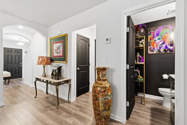 Arched foyer with powder room off the entry