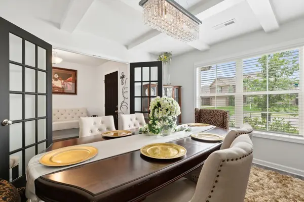 Formal dining under a coffered ceiling