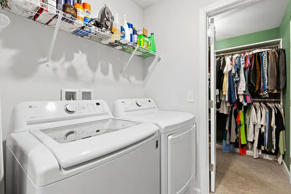 Dedicated laundry room with walk-in storage